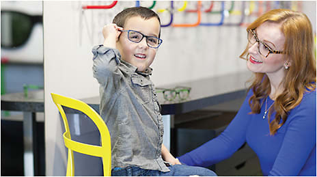 JUST FOR KIDS. “Having a child excited about getting glasses starts with making them (and their parents) feel at ease. We do this with a space specifically for them that is colorful and appealing, yet not distracting,” says Sheena Taff.
