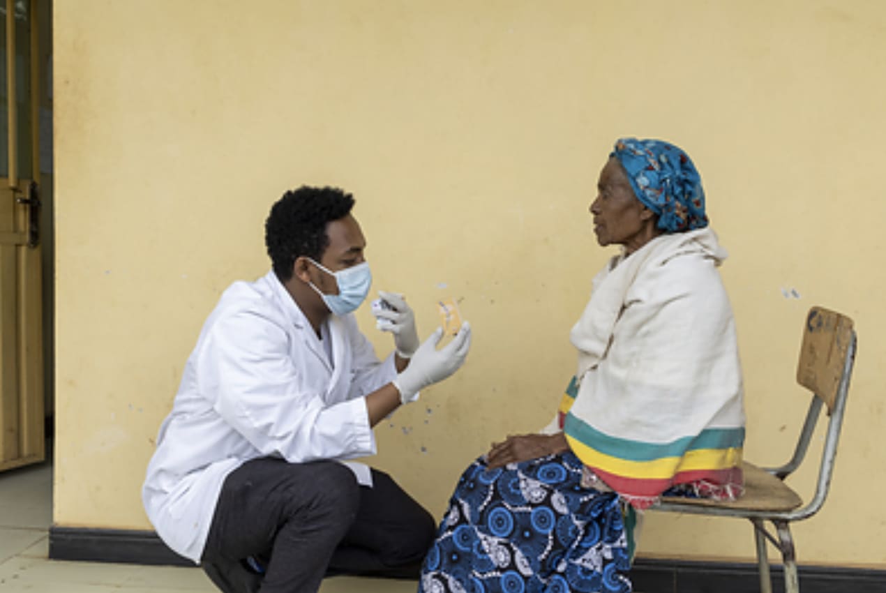 In Arba Minch, Ethiopia, Dr. Basliel, an Orbis-trained surgeon, examines patient Mosho, 85, after performing a successful cataract surgery. Image courtesy: Jenny Barker.