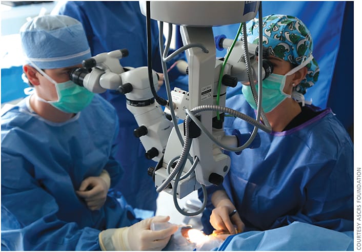 Henry ‘Hank’ Wynn, MD (left), of the University of Tennessee Hamilton Eye Institute and Emily Taylor Graves, MD (right), of Duncan Eye, PLLC, conduct an Operation Sight surgery during the inaugural Ivan Marais Cataract-A-Thon at Hamilton Eye Institute in June. Surgeons completed 30 cataract surgeries in one day.