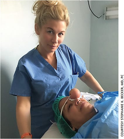 Stephanie Becker, MD, treats a patient in Honduras. Without the same tools and supplies she would have in the United States, Dr. Becker used a “homemade” device to reduce the patient’s IOP prior to surgery.