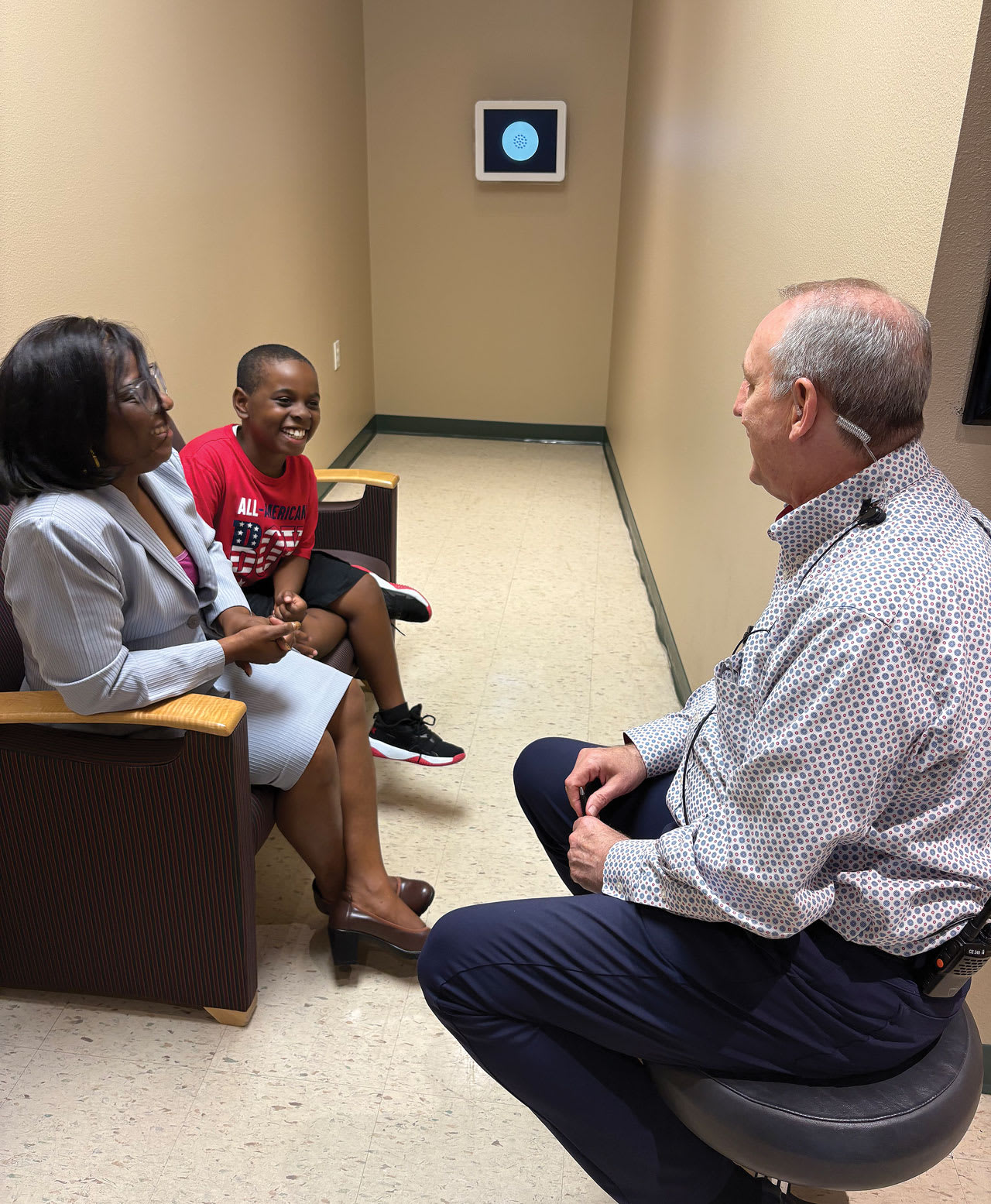 Dr. Stephen explains myopia to both a parent and her child. (Photo courtesy: Dr. Stephen)