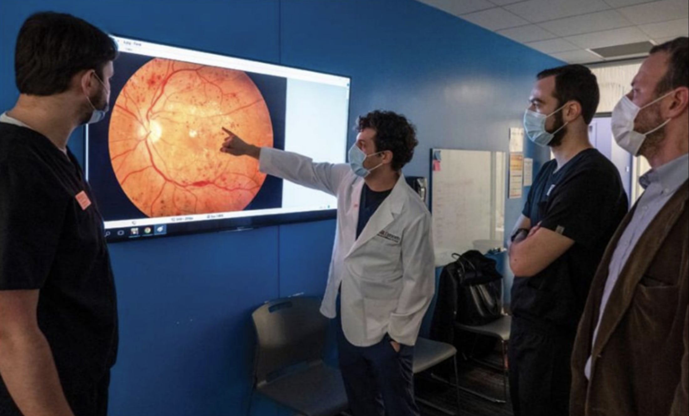 Dr. Nabhan engaging optometry students at UMSL in teleretina. Dr. Nabhan guided UMSL's first-ever teleretina service with community health center partner, Affinia Healthcare.