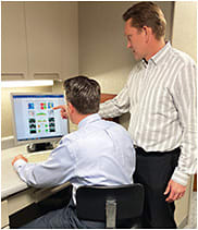 Dr. Lifferth sharing patient information with a collaborating M.D. Photo courtesy of Dr. Austin Lifferth.