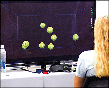 An athlete tracks three of eight objects on NeuroTracker.
Courtesy of Jayson Teig/High Performance Vision Associates