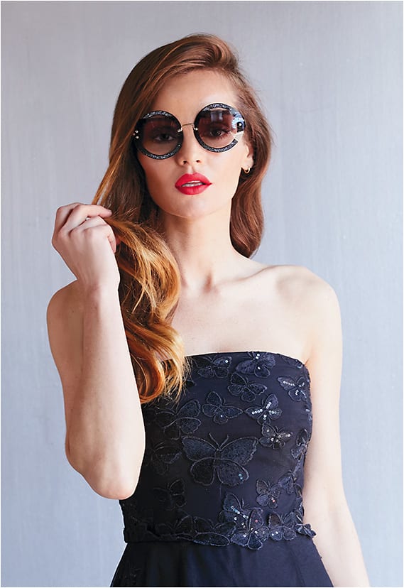 Round + Round
Miu Miu style MU 06SS from Luxottica flaunts an acetate front with raw-cut overlapped lenses and glitter fabric inserts.