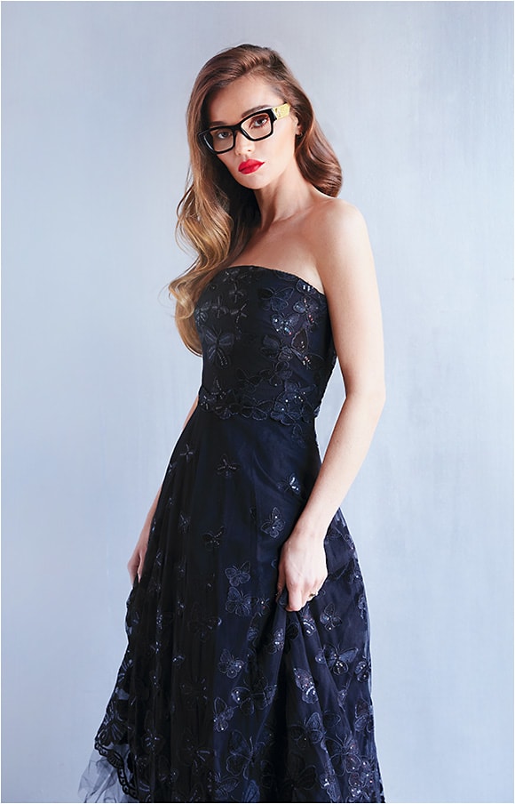 A Side of Glam
Gucci style GG0104O from Kering boasts a full side of gold-hued glitter to complement the chunky black acetate front.