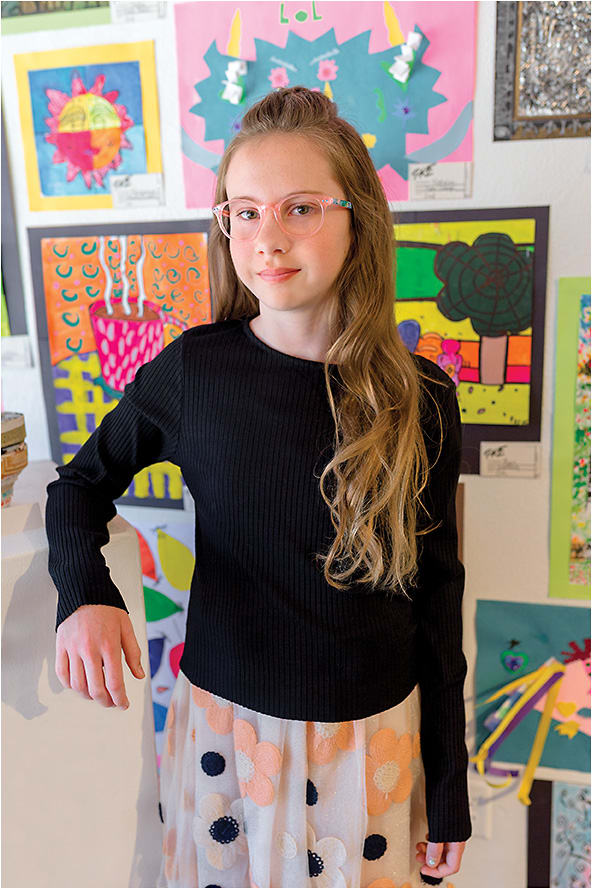 COLOR PLAY
On Giada: The Lilly Pulitzer Carlton Mini from Kenmark Eyewear is a playful round with a translucent acetate front in light pink paired with a signature colorful print on the temples.