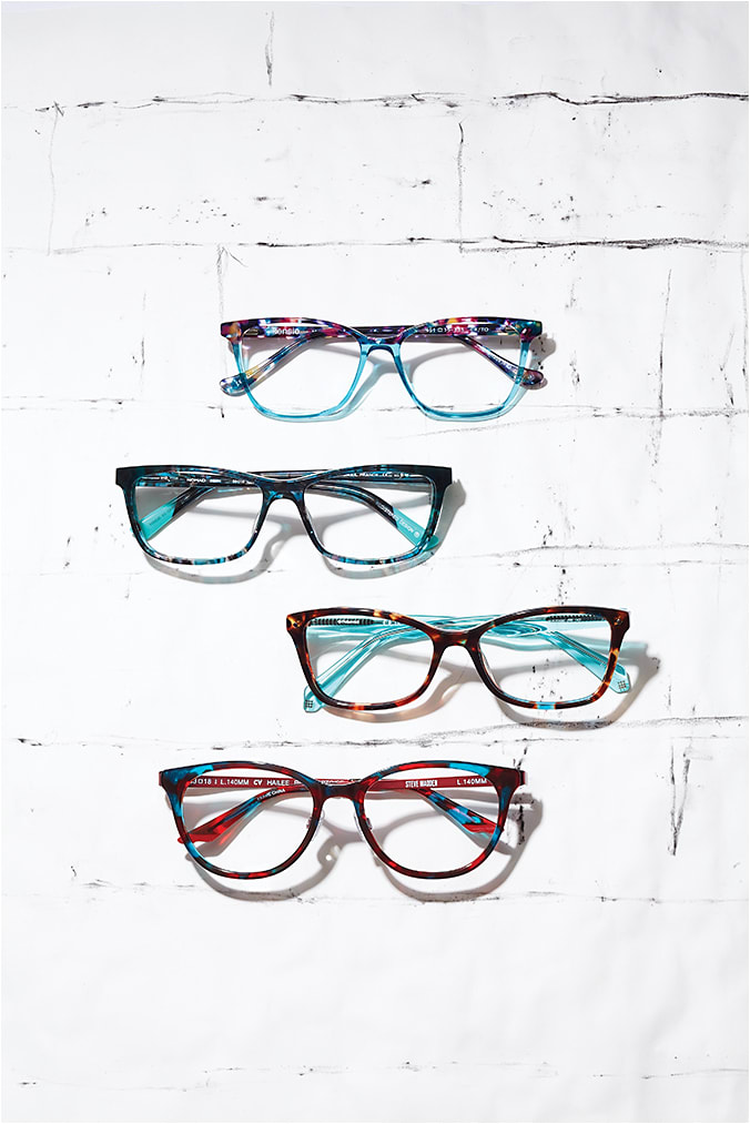 RETUNED TORTS
TORT plays with light and pattern with unexpected touches of crystal and blues for calming, cool styles. From top: 
» Kensie style Romance from Kenmark Eyewear tops a crystal blue with a re-energized pink and blue tort bridge and temple.
» Nomad style 3036N from Morel is a watery take on tort with blues and crystals creating a dreamy mix.
» Polaroid style PLD D320 from Safilo serves up serious style with a havana/blue-speckled front and crystal blue temples.
» Steve Madden style Hailee from Clear-Vision Optical offers millennial-approved brights with hot pops of blue and red tort.
