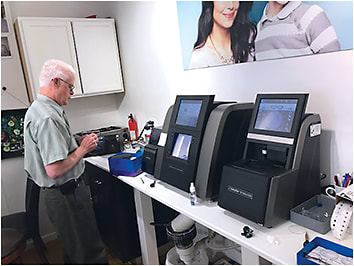 Optician Tim Grant works in the finishing lab in the newest Lenses Only location in Meriden, CT