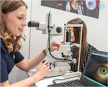 3 Taking a closer look at the Alcon booth.