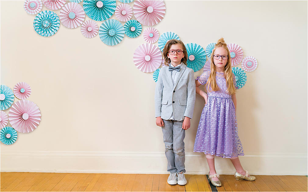 FIRST DANCE
(From left) 
On Kaizer: Huveli Milano 3081 in color 2 from Tekā Eyewear is a layered acetate style with a double bridge and replaceable spring hinge.
On Izzy: Kensie Girl style Fame in purple from Kenmark Eyewear features star pattern detailing on the temples with a sparkly core wire.