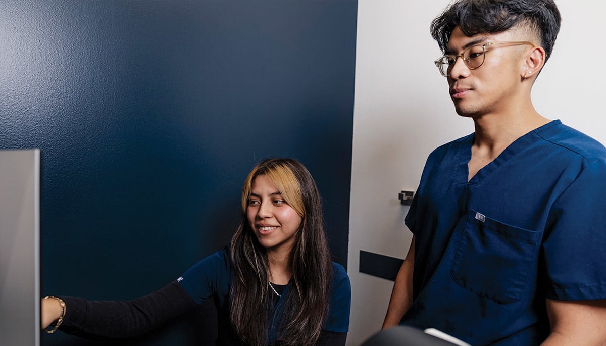 Diana Flamenco and Paul Paterno, technicians, review testing for patient in preparation for their appointment with Dr. Bedrood.