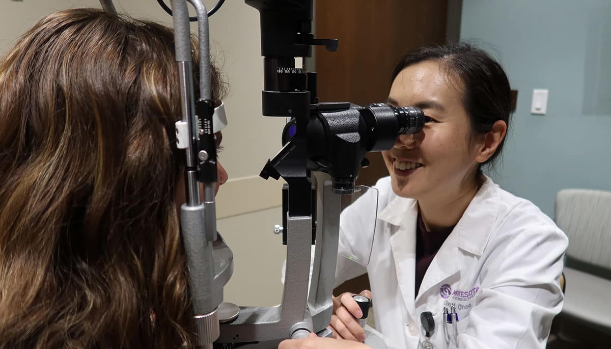 Clara Choo, MD, at the slit lamp preparing for a gonioscopy.