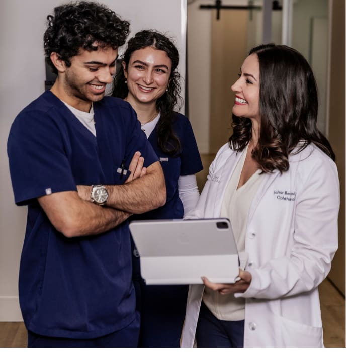 Dr. Sahar Bedrood, and her team of technicians and scribes (Ethan Carroll, Saya Davani) review patient testing ahead of the examination.