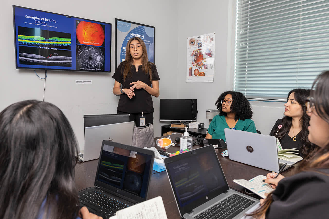 Education Coordinator Sarah Benavides teaching a new class of clinic team members retina pathology. All images by Amy Wolf Photography