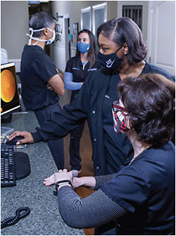 From left to right: Dr. Budev with Amber Naylor, COA, Tasha Pope, MA, patient care specialist, and Temis Hellberger, COA.