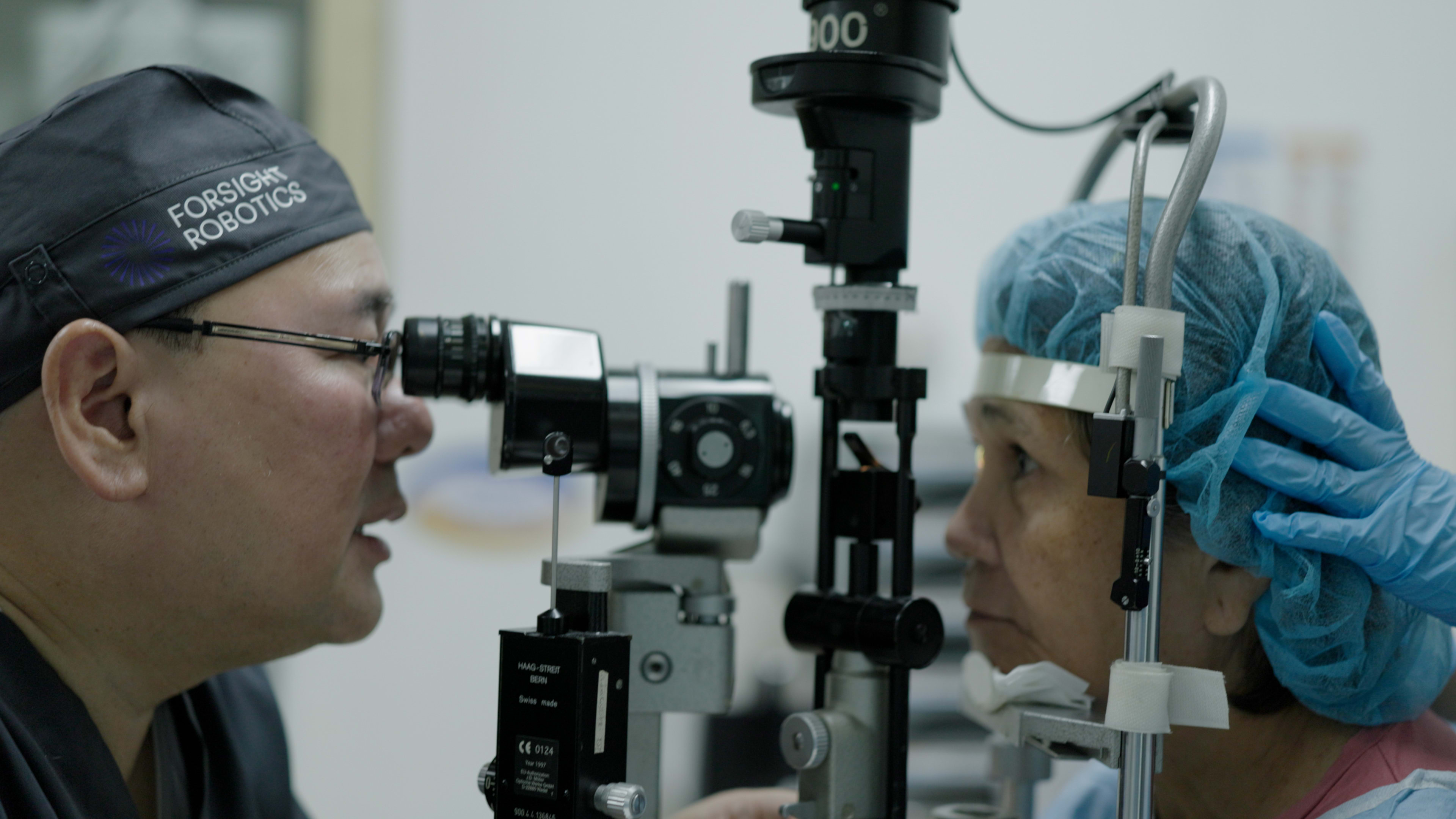 Dr. Robert Ang, serving as the study principal investigator, performs a post-op patient exam.