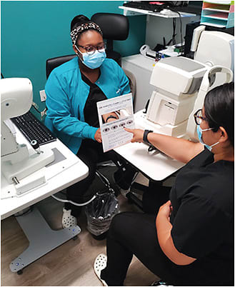 Dr. Davison uses chair time to educate on a practice offering.Photo courtesy of Dr. Janelle Davison.