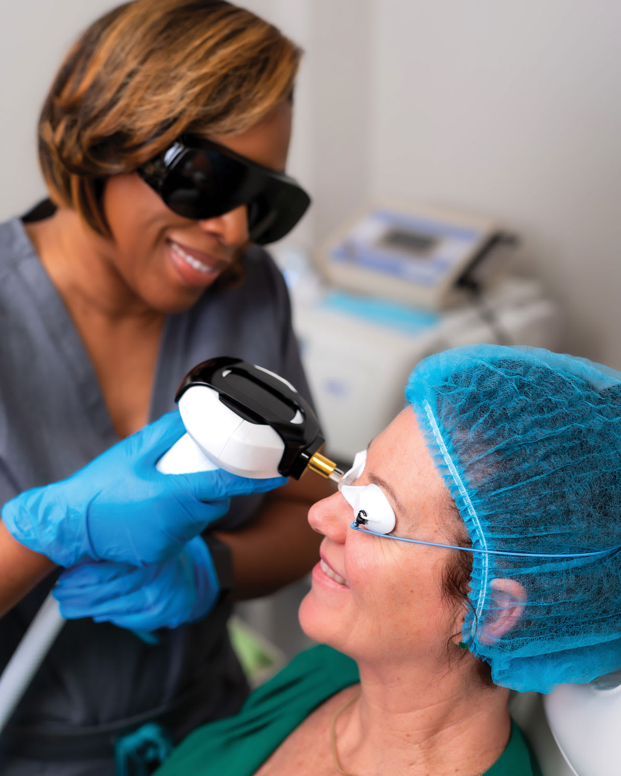 Me performing IPL on one of my patients suffering from ocular rosacea, MGD, and dry eye signs and symptoms.  (Photo courtesy: Middle Way Marketing)