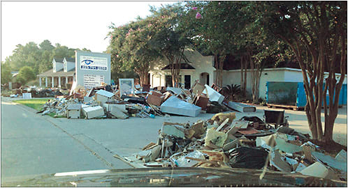 Piles of ruined drywall, insulation, cabinets and other debris litter the street awaiting pickup and removal by waste management contractors weeks after the author’s practice was gutted in the wake of a massive flood.
All photos courtesy of Dr. Chris Wroten.