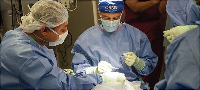 On a mission with Orbis to Kolkata, India, Dr. Dugel operates in the OR of the Flying Eye Hospital.