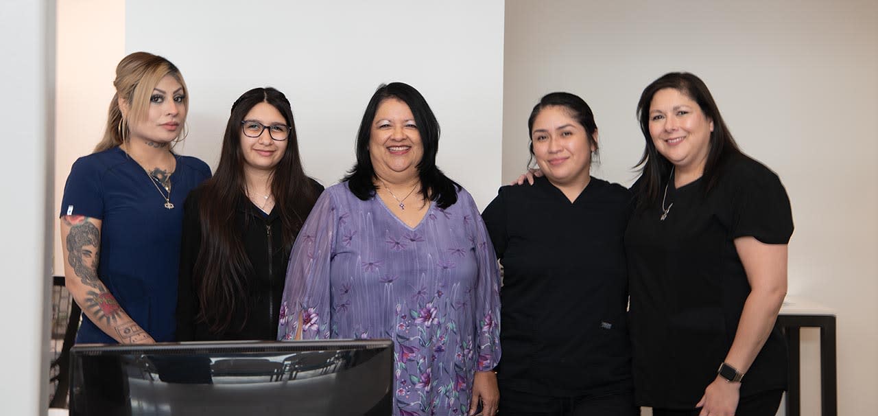 Stone Oak Ophthalmology Center’s office manager Veronica (center), flanked by her front office staff. Viviana and Zadya stand to her right and Stephanie and Monica to her left. All images by Catherine Warren