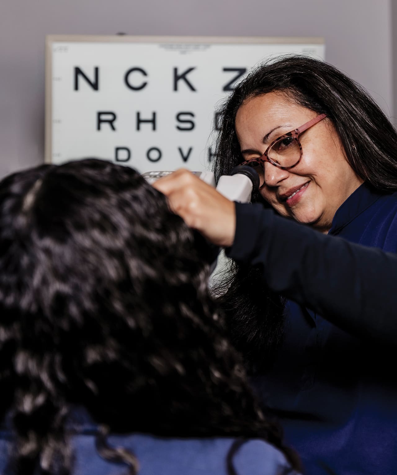 Ofelia Portillo takes a measurement on a patient in preparation for their examination. With 17 different testing devices in use every day, it is a priority at AVC to make sure each patient is thoroughly examined.
