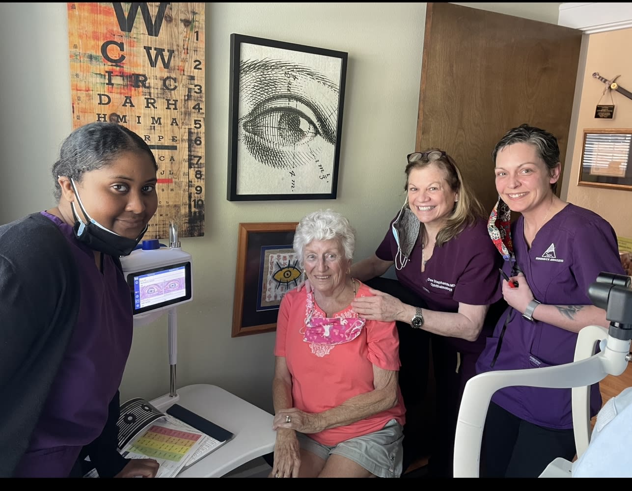 Dr. Stephenson and her staff discussing a surgical plan with a patient for femtosecond laser cataract surgery.