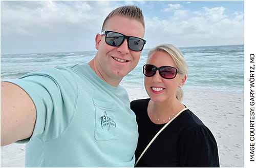 Gary Wörtz, MD, and his wife on a beach enjoying that hard-won balance.