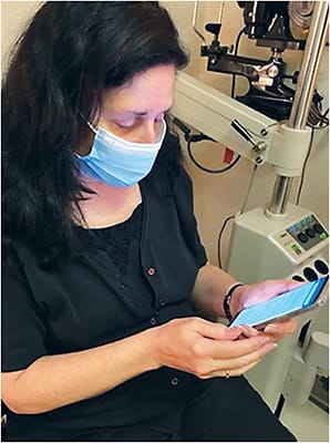 A presbyopic patient viewing their phone via multifocal CLs.Image courtesy of Dr. Susan Resnick.