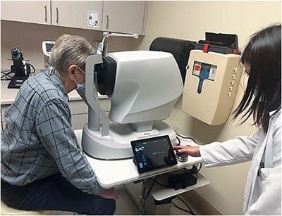 Dr. Sharon Han sets up a patient to have images taken with a retinal camera at the Sepulveda VA Ambulatory Care Center. Most patients are familiar with cameras, and don’t have any undue concern about having images taken of their eyes, says Dr. Ferrucci.Photo courtesy of Dr. Ferrucci