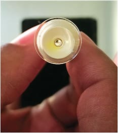 Figure 1. Plunger for inserting scleral lenses with the bottom cut out allows light to pass through, thus creating a fixation target for the patient. Images courtesy of Dr. Jason Compton.