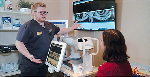 A Bowden Eye &amp; Associates staff member discuses meibomian gland imaging with a patient.
Photo courtesy of Ethan Bates