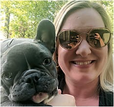 Dr. O’Brien, who is wearing polarized sunwear, with dog, Luna. Photo courtesy of Dr. Kristin O’Brien.