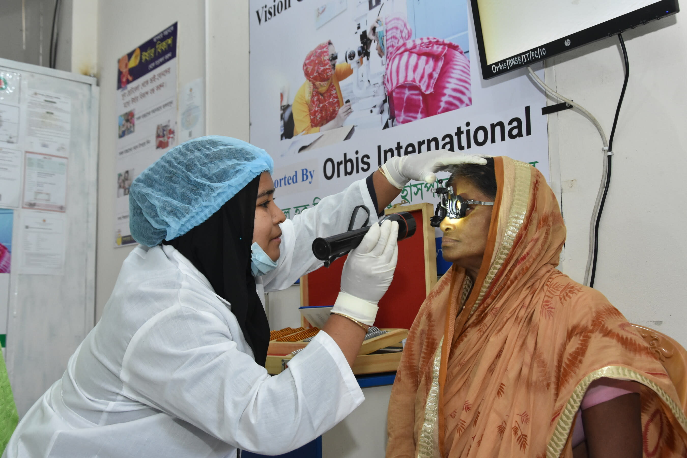 A woman is screened at an Orbis-supported women-led green vision center near Chattogram, Bangladesh.