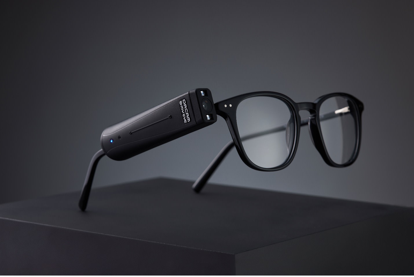 Figure 2. Attached to a pair of spectacles, MyEye Pro (OrCam) uses voice-activated, intuitive artificial intelligence to audibly describe what’s in a room, respond to open-ended queries for specific information, and help the user recognize faces.