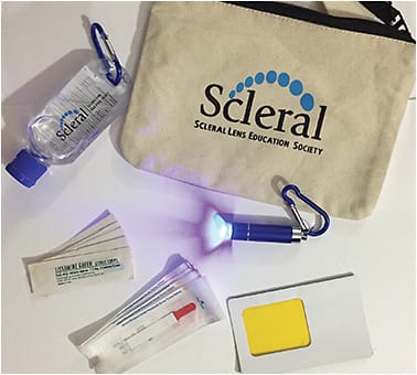 Figure 4. A kit to provide to each patient for remote evaluation. The kit includes alcohol-based gel, fluorescein, lissamine green, a yellow filter, and cobalt blue light.