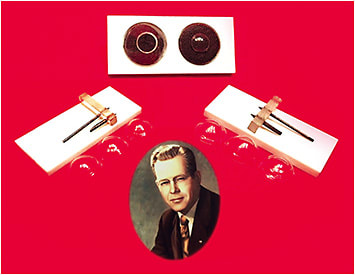 Figure 1. Tools and lenses made by Dr. Dennis C. England in 1945. Two lens diameter tools are shown: 7.8mm on the left and 11.5mm on the right.Photos courtesy of Contact Lens Museum in Forest Grove, OR