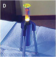 Figure 9. (D) A scleral lens stand can help patients who need more control of their eyelids during scleral lens application.Image courtesy of Dr. Fayiz Mahgoub