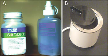 Figure 1. (A) Salt tablets to make homemade saline; (B) Heat unit for the disinfection of soft contact lenses.Image courtesy of Graeme Young