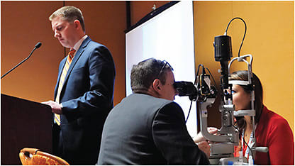 Figure 1. Presenters of the preconference scleral lens workshop during a scleral lens fit evaluation (left to right): Matt Kauffman, OD; Dan Fuller, OD; and Pam Satjawatcharaphong, OD.