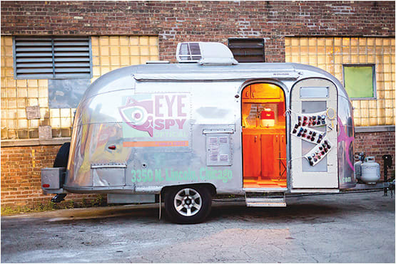 Eye Spy Optical’s gleaming Airstream trailer is a flashy attention-getter, coaxing passers-by to stop and learn a little about giving opportunities.
PHOTO: TK PHOTOGRAPHY
