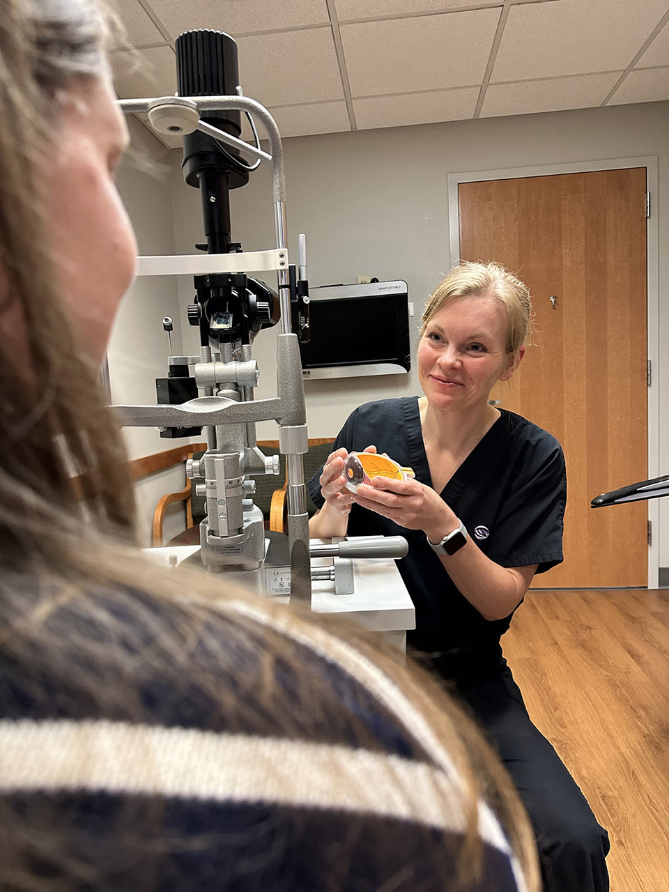 Christine Larsen, MD, discusses glaucoma interventions with her patient. (All photos courtesy of Minnesota Eye Consultants)
