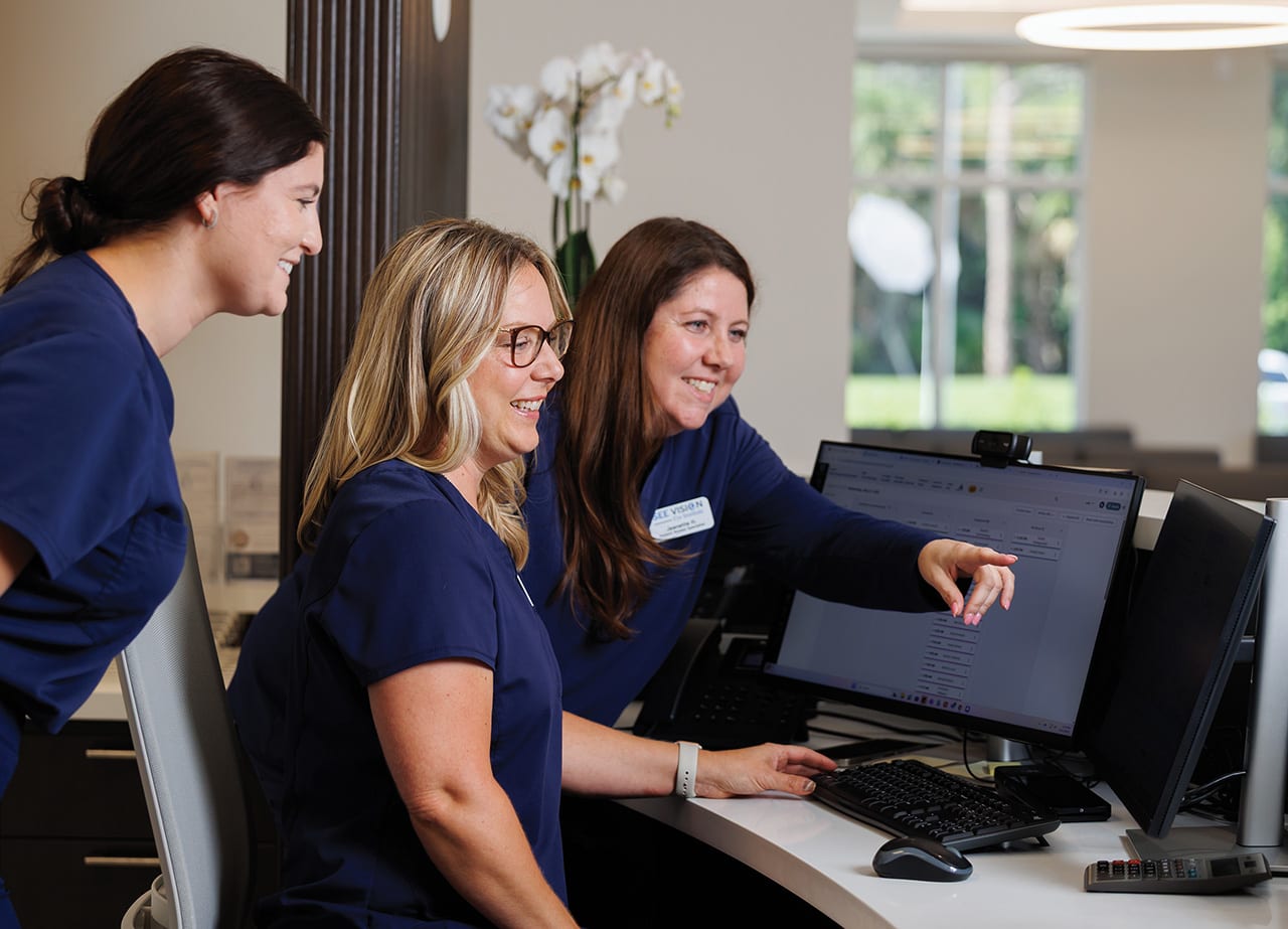 Patient services specialists (from the left) Alyssa Ortisi, Tracy Lorusso, and Jeanette Hennessey collaborate closely at the front desk, combining efficiency and warmth to create a welcoming experience for every patient.