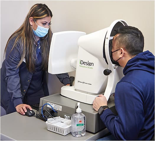 Cristina Perez-Vega, ophthalmic technician, takes measurements with the iDesign Refractive Studio.