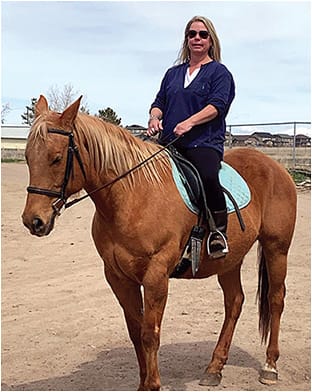 Zolly Kane riding and guiding horses at her One Horse Rescue in Denver.IMAGES COURTESY ZOLLY KANE, COA, CST