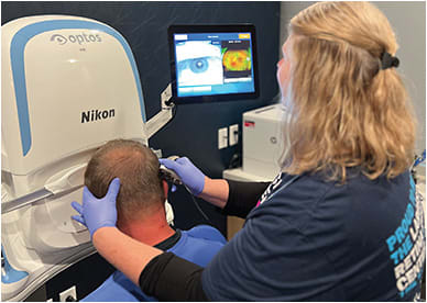 Ms. Cheshier shown at work at an ultra-widefield imaging device (California, Optos). IMAGE COURTESY OF HOLLY CHESHIER, CRA, OCT-C, COT, FOPS