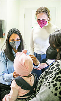 Colleen Konwinski, ophthalmic assistant (top), assists Dr. Bohra.