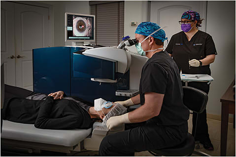 David T. Vroman, MD, is assisted by Amanda Utsey, COA, during a laser procedure.