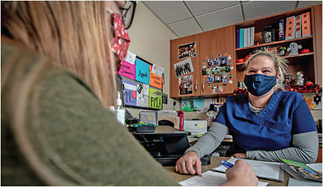 Brooke Pearcy, COA, surgical counselor, answers questions and provides patient guidance.